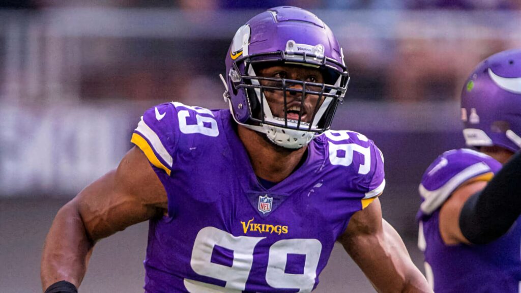 Danielle Hunter Minnesota Vikings in purple uniform intense action NFL football dynamic wallpaper