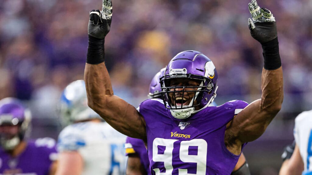 Danielle Hunter Minnesota Vikings celebrating win in purple and gold NFL uniform wallpaper