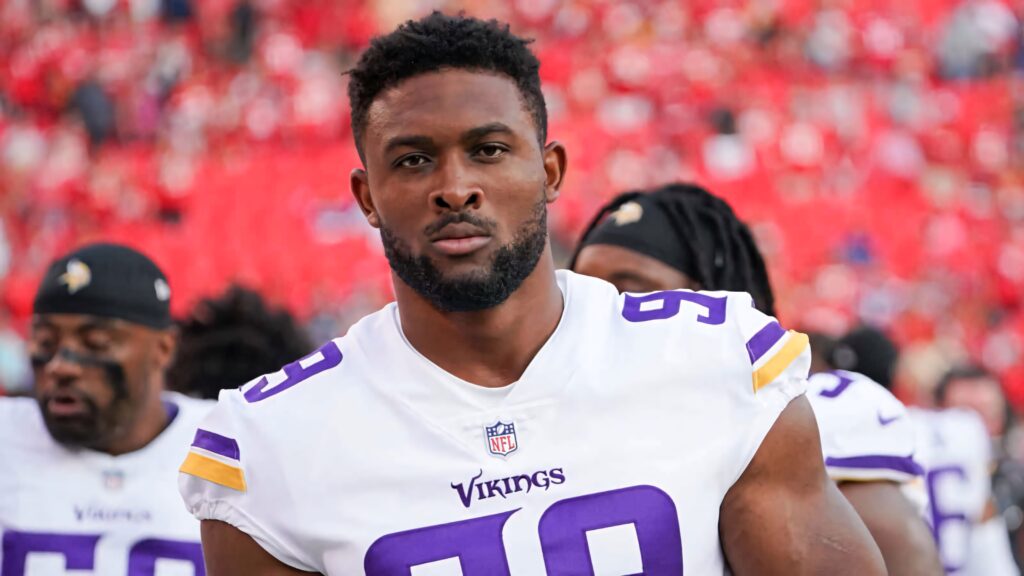 Close-up of Minnesota Vikings defensive end Danielle Hunter in jersey 99 with intense expression Wallpaper