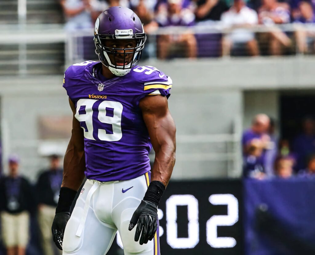 Danielle Hunter in Minnesota Vikings uniform focused on field intense NFL player action wallpaper