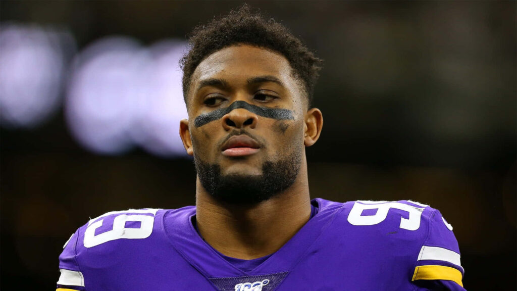 Danielle Hunter Minnesota Vikings in purple jersey showing fierce focus in NFL game wallpaper