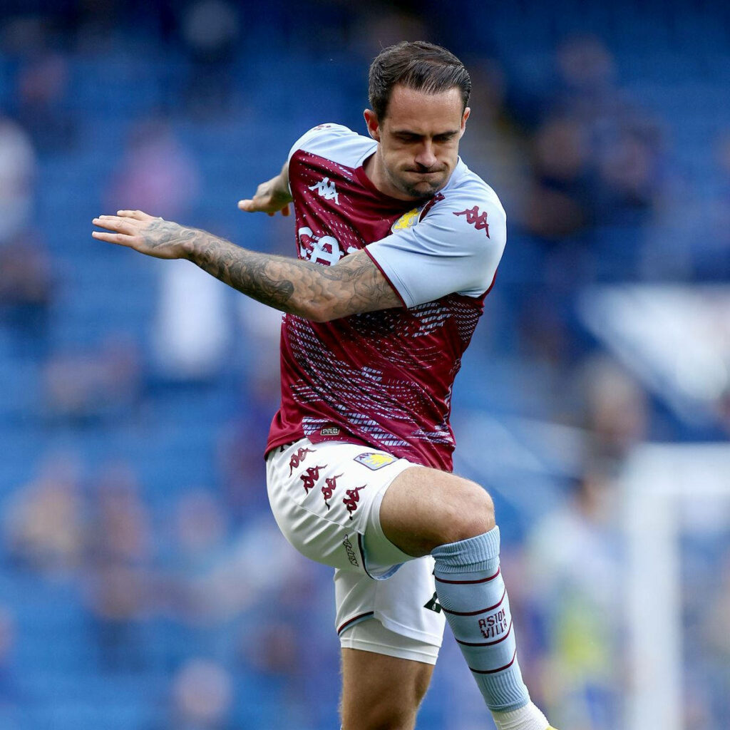 Danny Ings Aston Villa action shot maroon light blue kit dynamic stadium background wallpaper