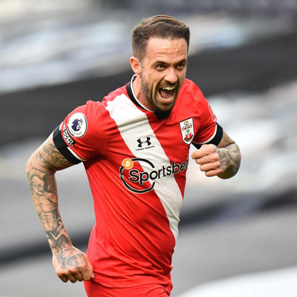 Danny Ings celebrating in Southampton red and white kit with detailed tattoos stadium background Wallpaper