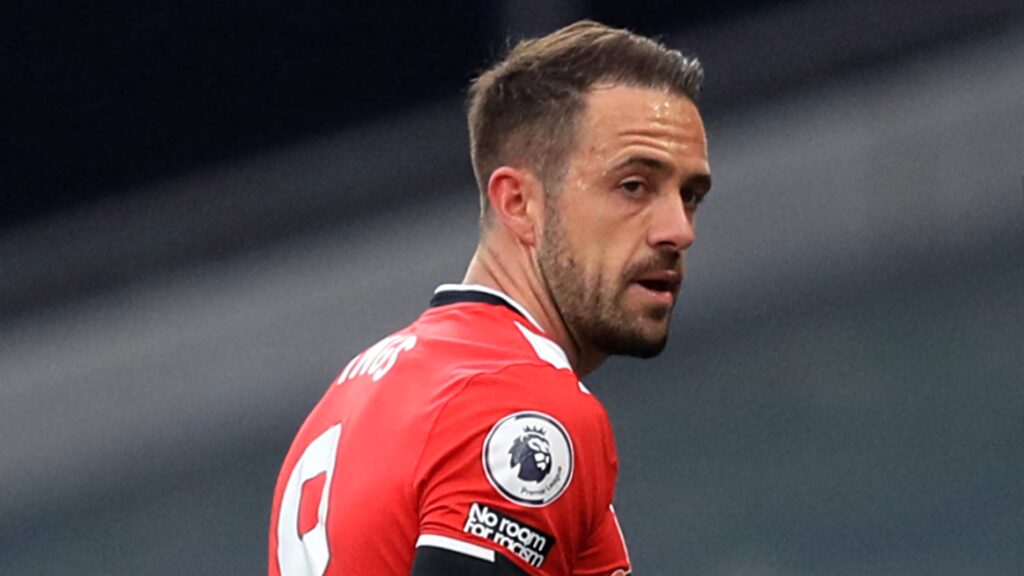 Danny Ings focused footballer in red Premier League jersey looking over shoulder intense wallpaper