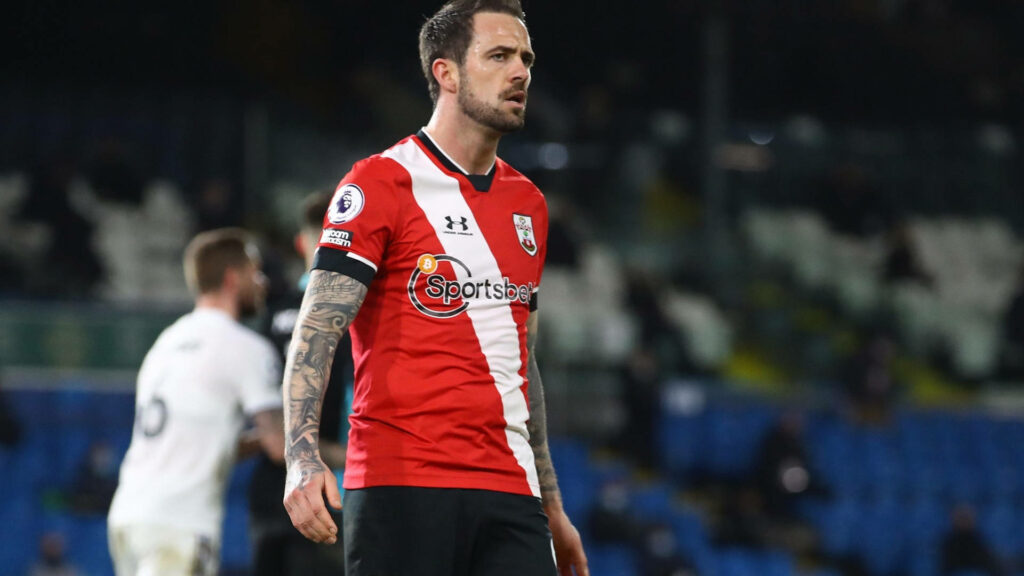 Danny Ings angry on football field in red Southampton kit intense vibrant wallpaper background