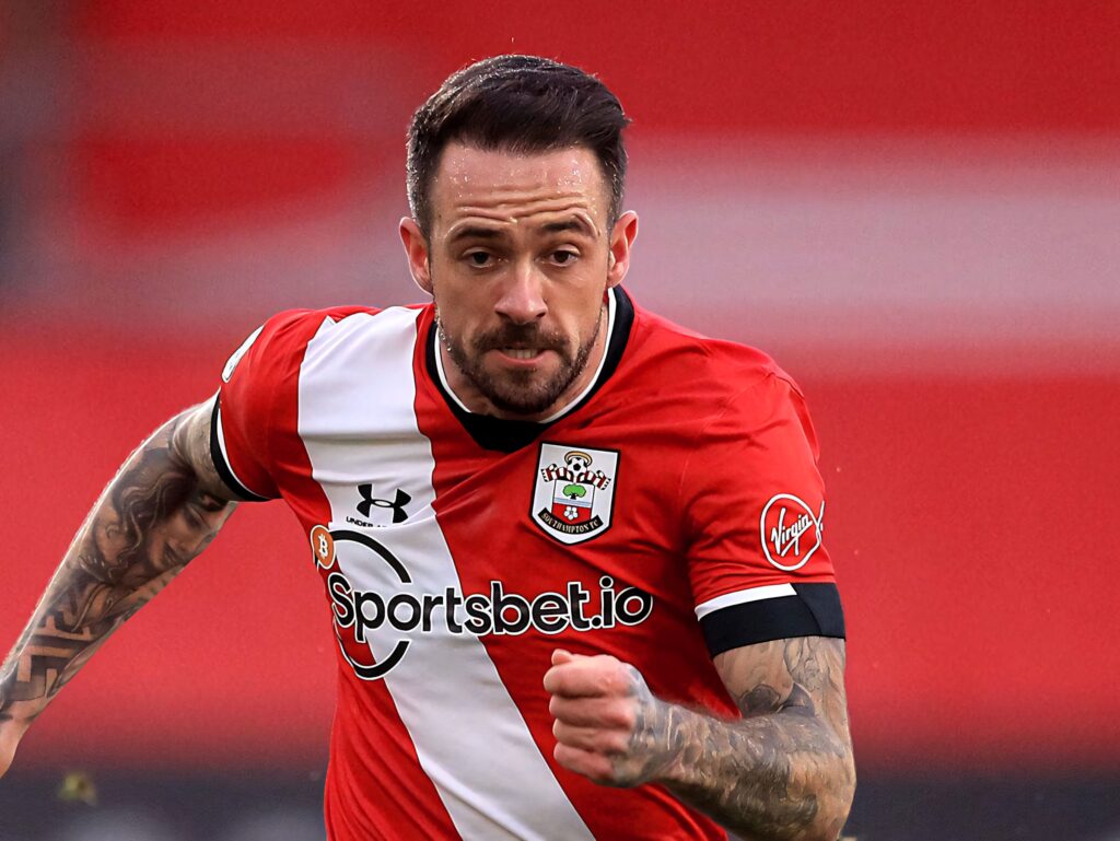 Danny Ings intense football run in Southampton red and white kit dynamic sports action wallpaper