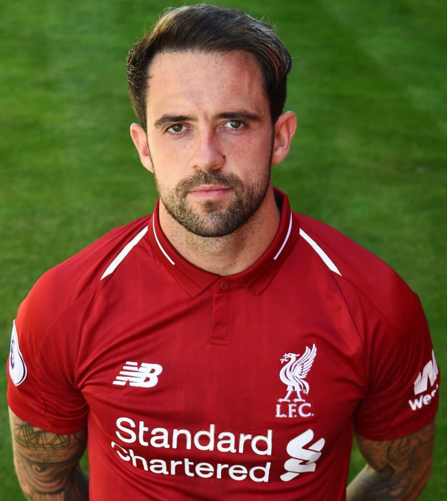 Danny Ings in Liverpool FC red kit focused intense stare green background high resolution wallpaper