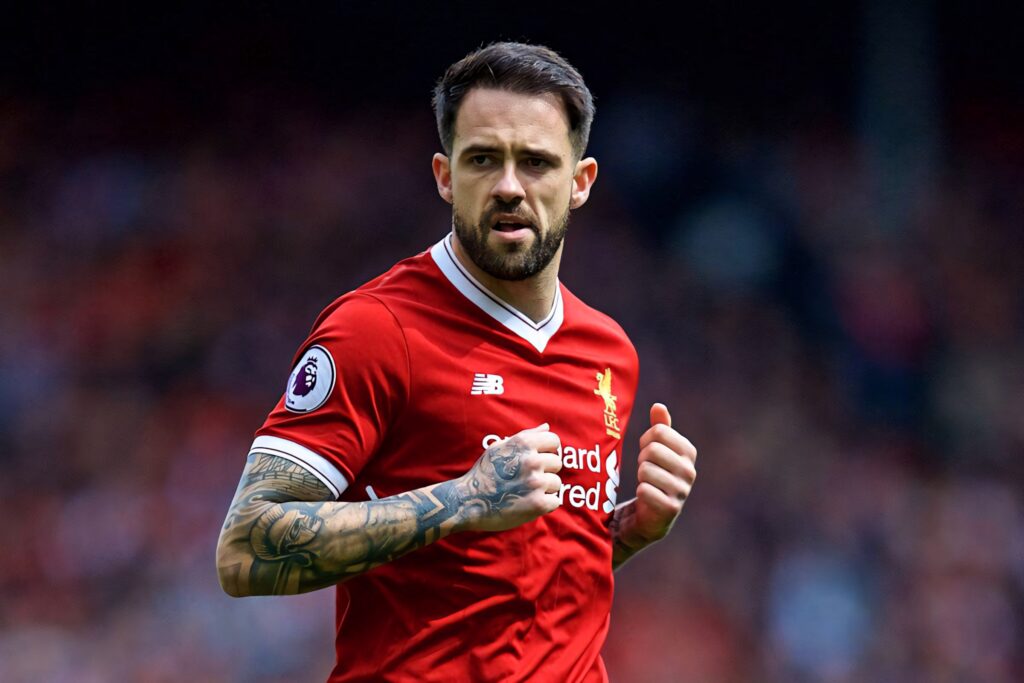 Danny Ings in red Liverpool jersey focused on soccer field showing intensity and passion game Wallpaper