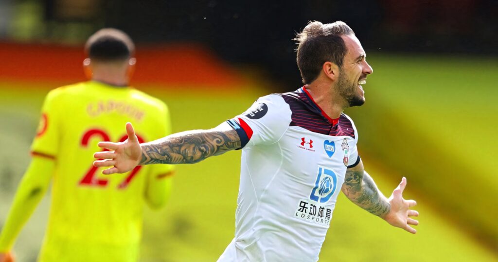 Danny Ings celebrates goal in Southampton kit with blurred Watford player background energetic match Wallpaper