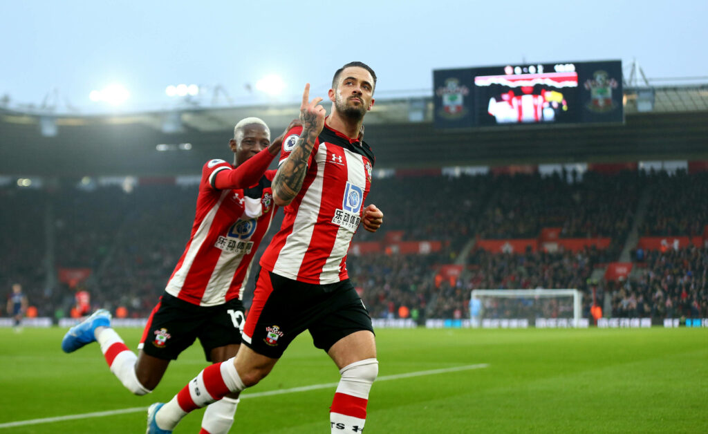 Danny Ings celebrating in Southampton kit showing passion and energy in a lively stadium background Wallpaper