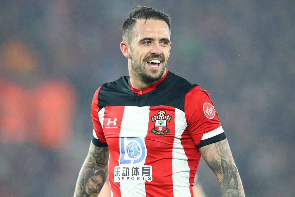 Danny Ings smiling in Southampton FC red and white kit during triumphant football match moment Wallpaper