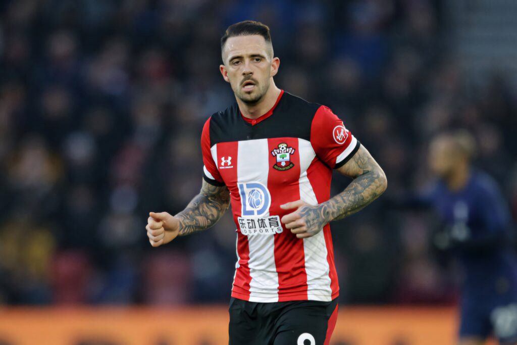 Danny Ings focused on pitch in Southampton FC kit showing tattoos and intense expression Wallpaper