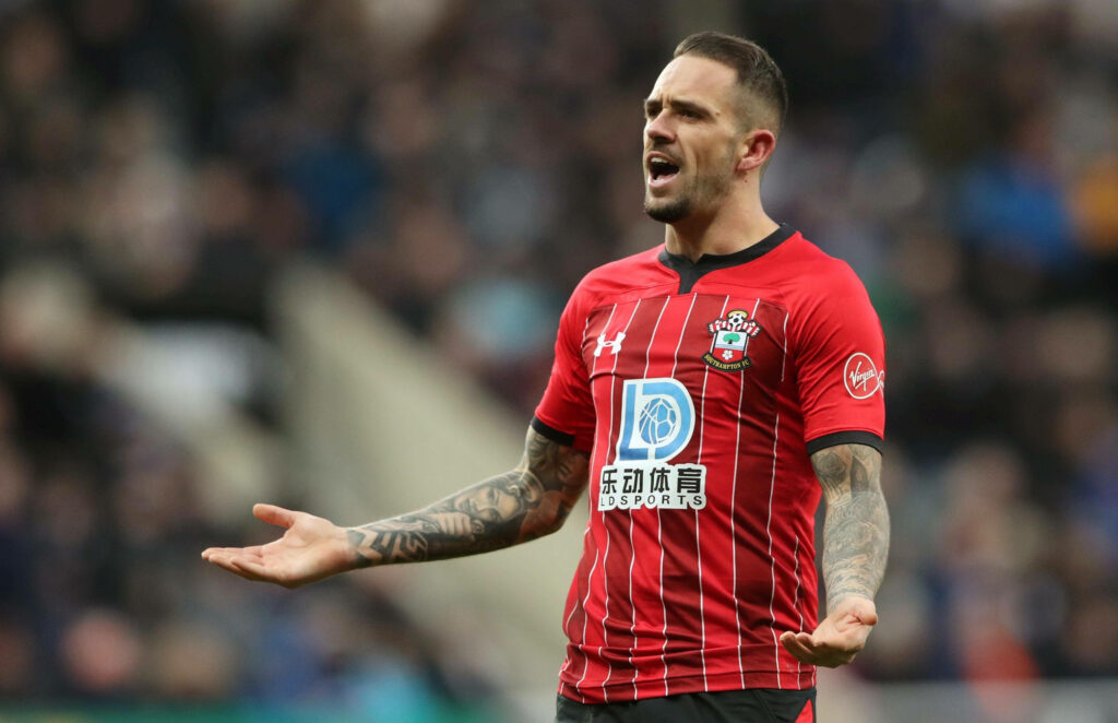 Danny Ings in Southampton kit mid-action with blurred stadium crowd showing intense football match Wallpaper