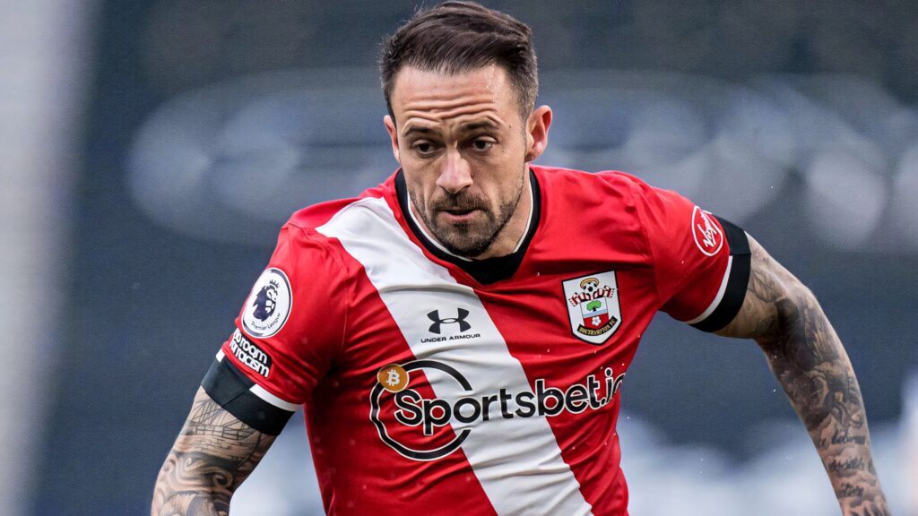 Danny Ings sprinting in Southampton kit showing athletic build and focused expression wallpaper