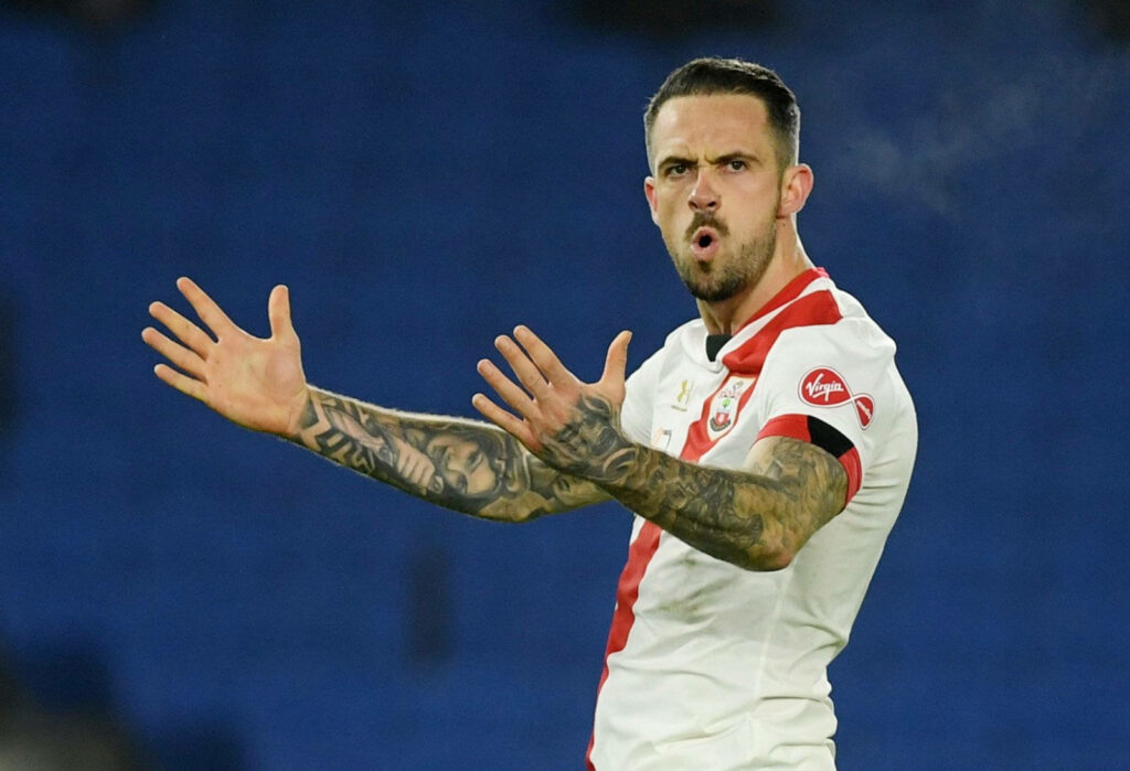 Danny Ings upset Southampton footballer in action showing frustration with tattooed arms vivid background Wallpaper