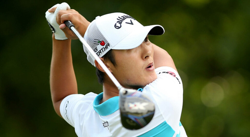 Danny Lee mid-swing golf wallpaper green background focused expression athletic form