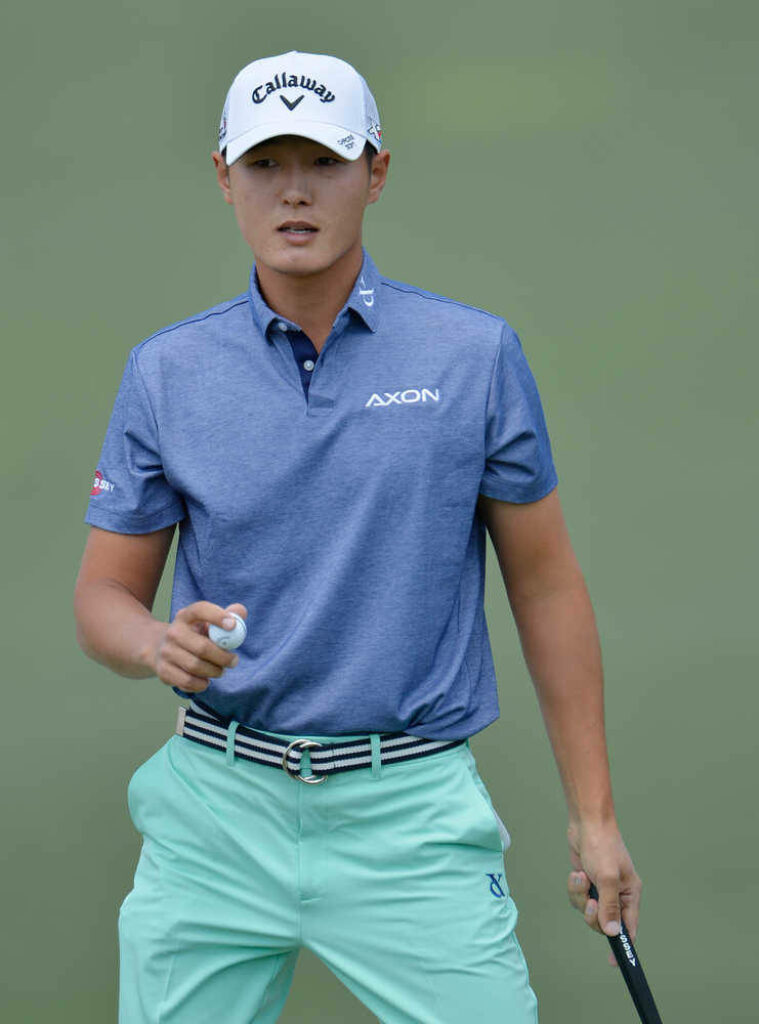 Danny Lee in blue Axon polo mint green pants Callaway cap golf course professional wallpaper
