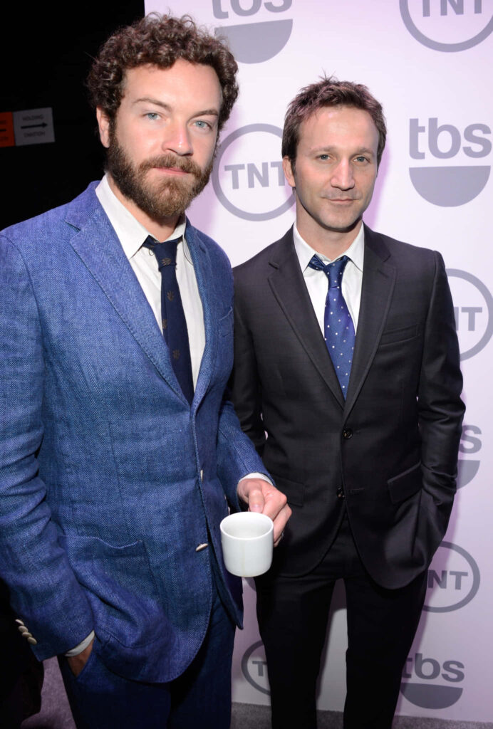 Danny Masterson and Breckin Meyer in formal suits at 2012 TNT and TBS Upfront event backdrop Wallpaper