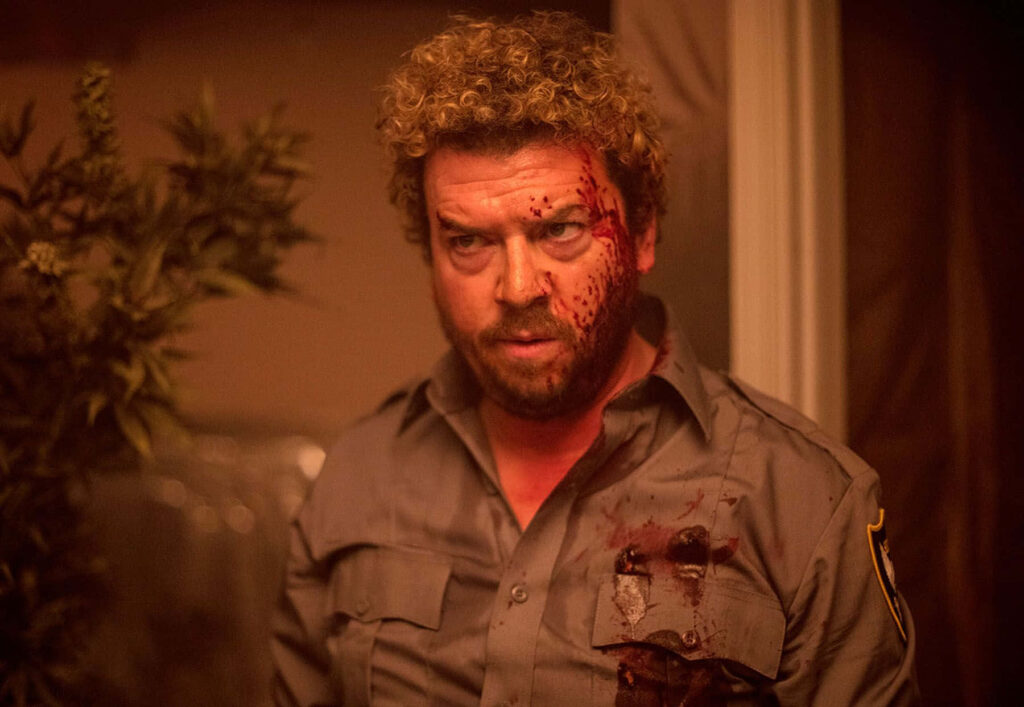 Danny McBride intense bloodied in grey uniform shirt warm lighting dramatic cinematic scene wallpaper