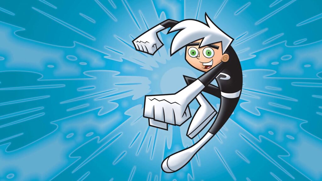 Danny Phantom mid-action with white hair green eyes black suit on vibrant blue supernatural background Wallpaper