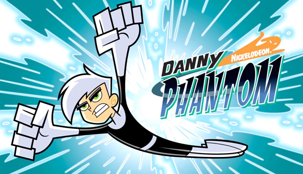 Danny Phantom flying in black and white suit with white hair on blue burst Nickelodeon wallpaper