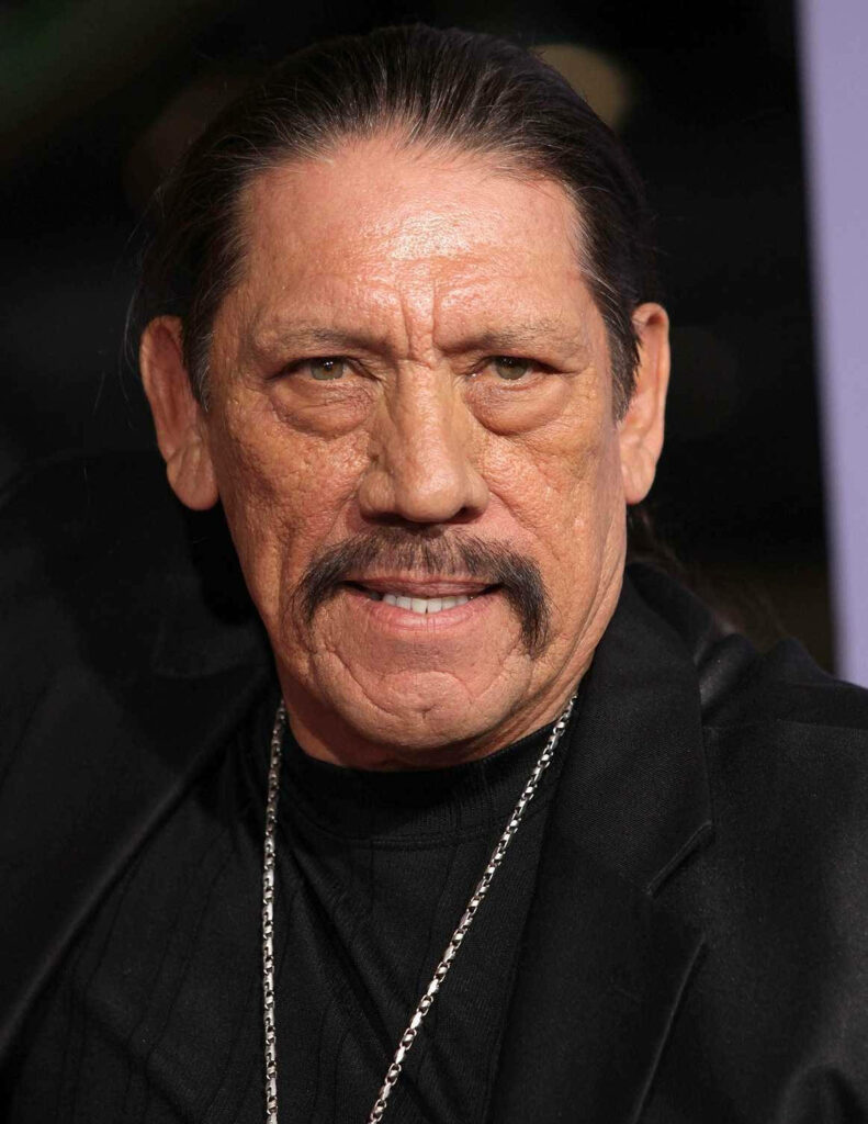 Danny Trejo intense portrait wallpaper with dramatic lighting emphasizing rugged facial features