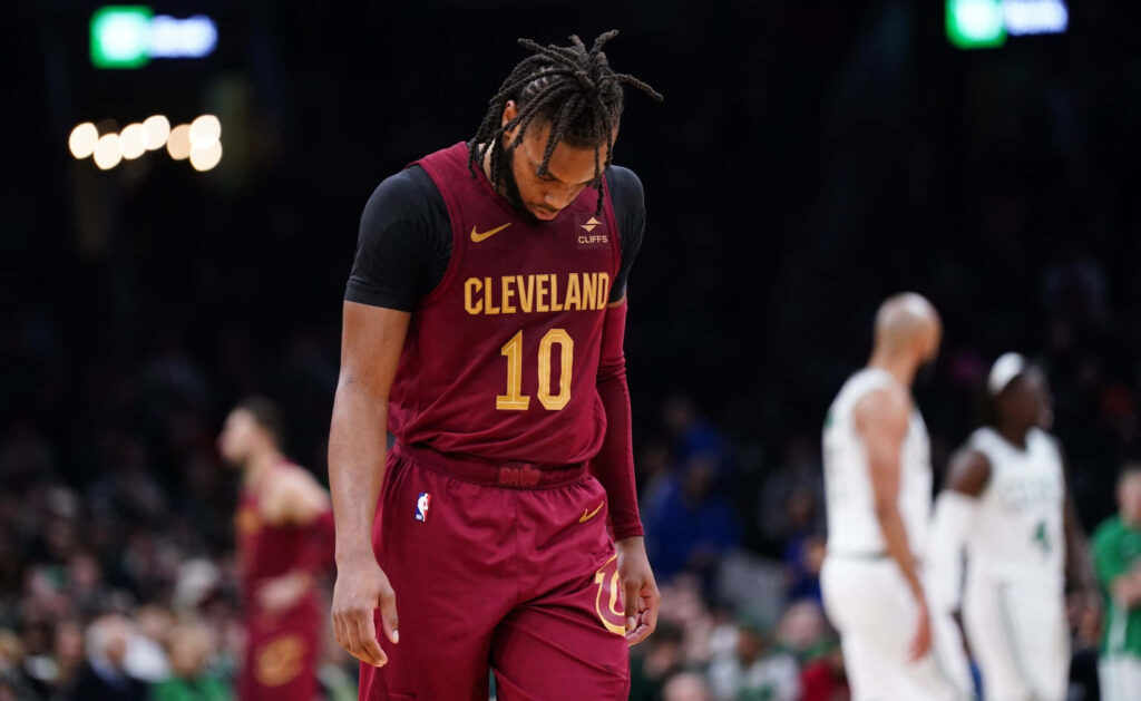 Darius Garland Cleveland Cavaliers maroon uniform deep contemplation on basketball court wallpaper background