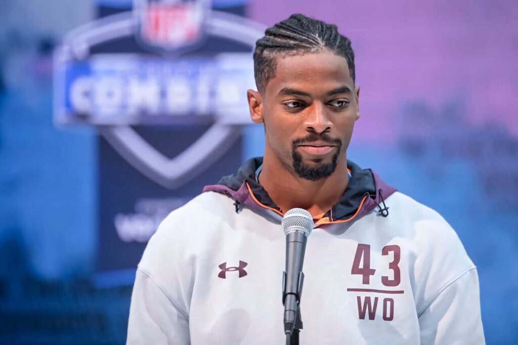 Darius Slayton in light gray hoodie at NFL Combine press conference with blue purple backdrop Wallpaper