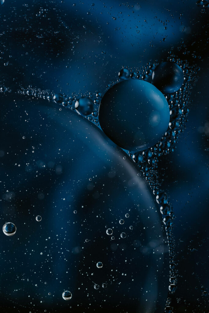 Dark Abstract Wallpaper: 3D Bubbles in Deep Blue Atmosphere