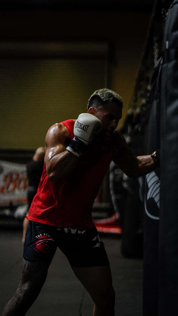 Dark aesthetic Brad Tavares gym wallpaper intense training muscular physique motivational background