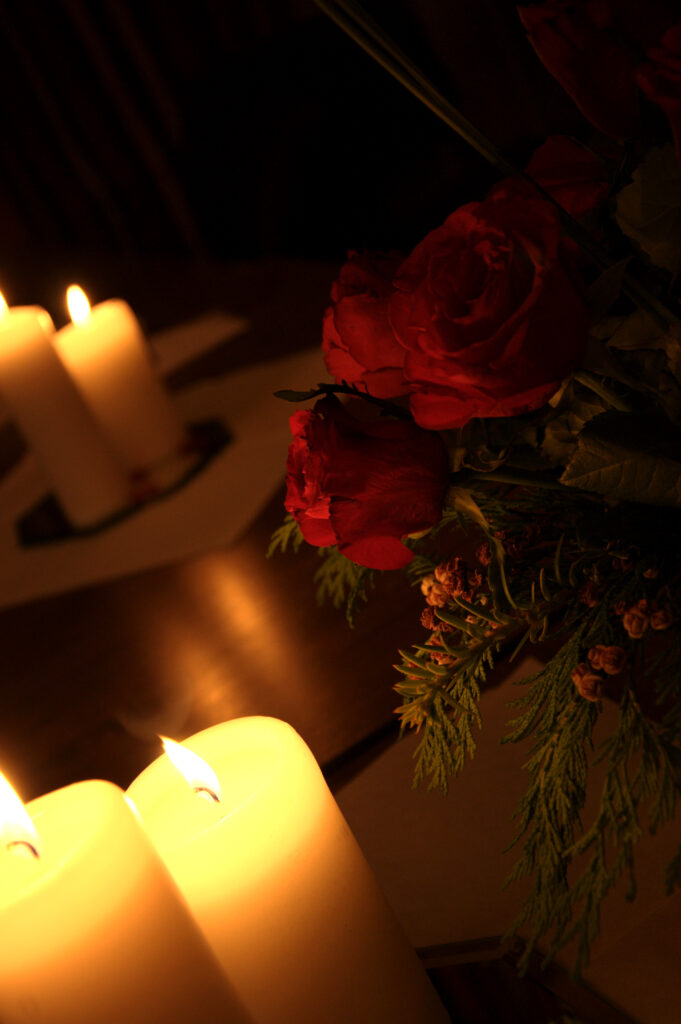 Dark Aesthetic Wallpaper: Glowing Candles & Vibrant Red Roses
