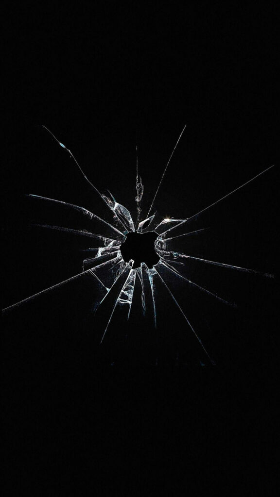 Dark Android wallpaper with realistic shattered glass effect and sharp cracks on black background