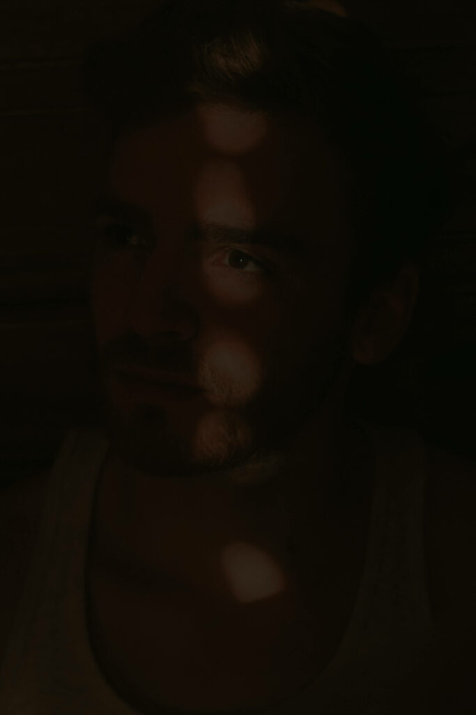 Mysterious Dark Portrait Wallpaper: Dramatic Lighting & Shadows
