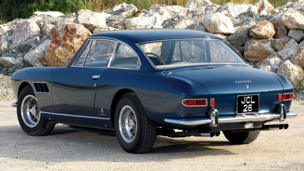 Vintage Elegance: Captivating Dark Blue Ferrari 330 GT Classic Berlinetta with Gleaming Chrome Rear Bumper Wallpaper