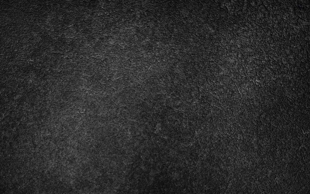 Dark textured concrete wallpaper with charcoal and slate grey tones for industrial design