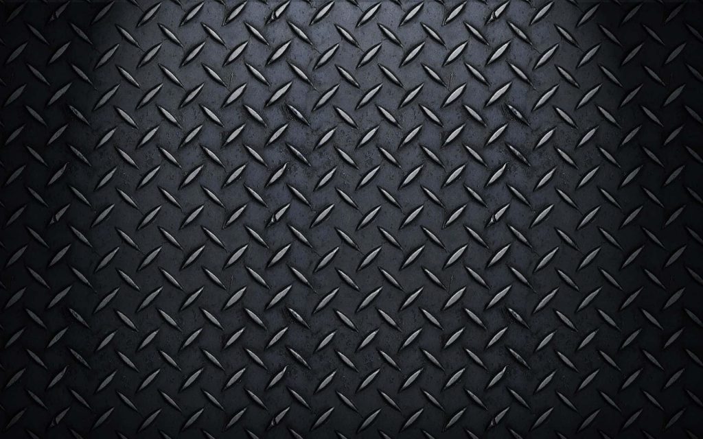 Dark diamond plate steel wallpaper textured with industrial tread pattern and moody lighting