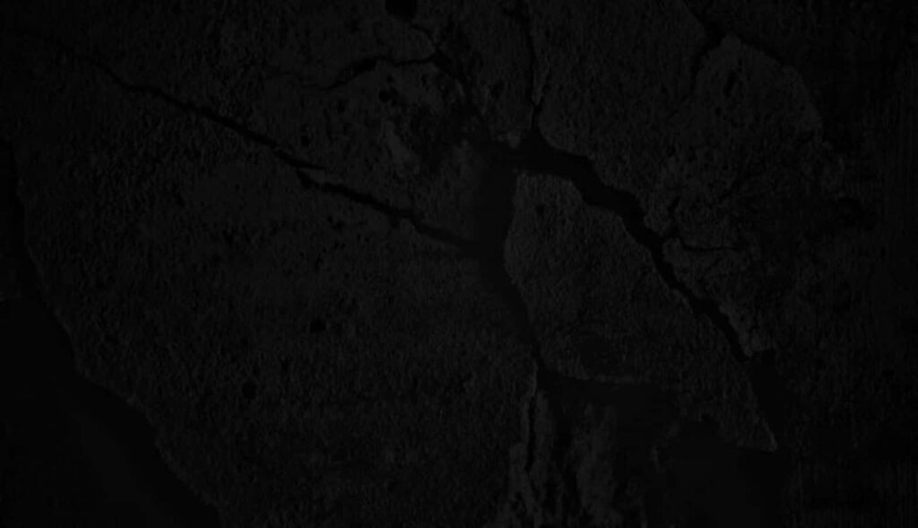 Dark Dramatic Wallpaper: Rough Cracked Black Concrete Texture