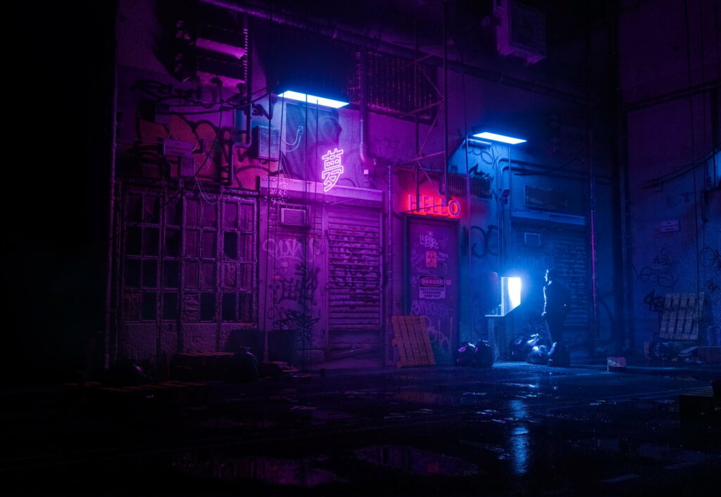 Gritty urban alleyway with futuristic neon lights - cyberpunk wallpaper