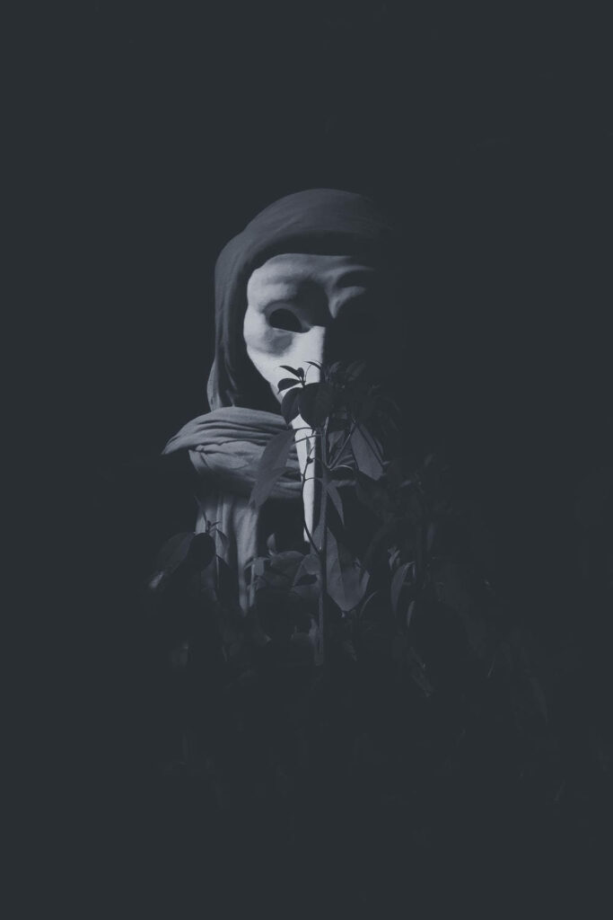Dark Guy Fawkes Mask Wallpaper: Mysterious Anonymity Background