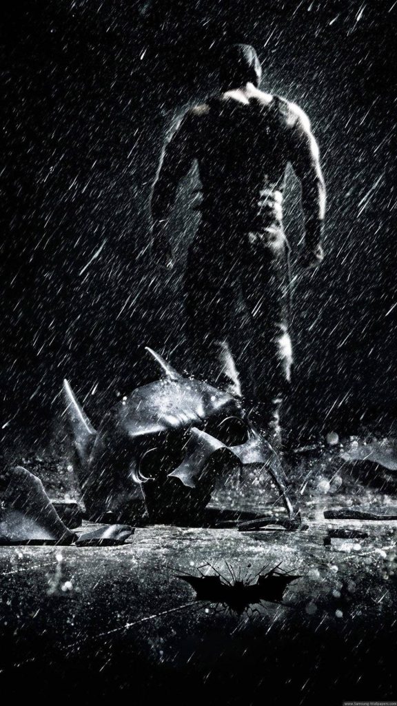 Muscular Bane in heavy rain over broken Batman cowl dark cinematic wallpaper background