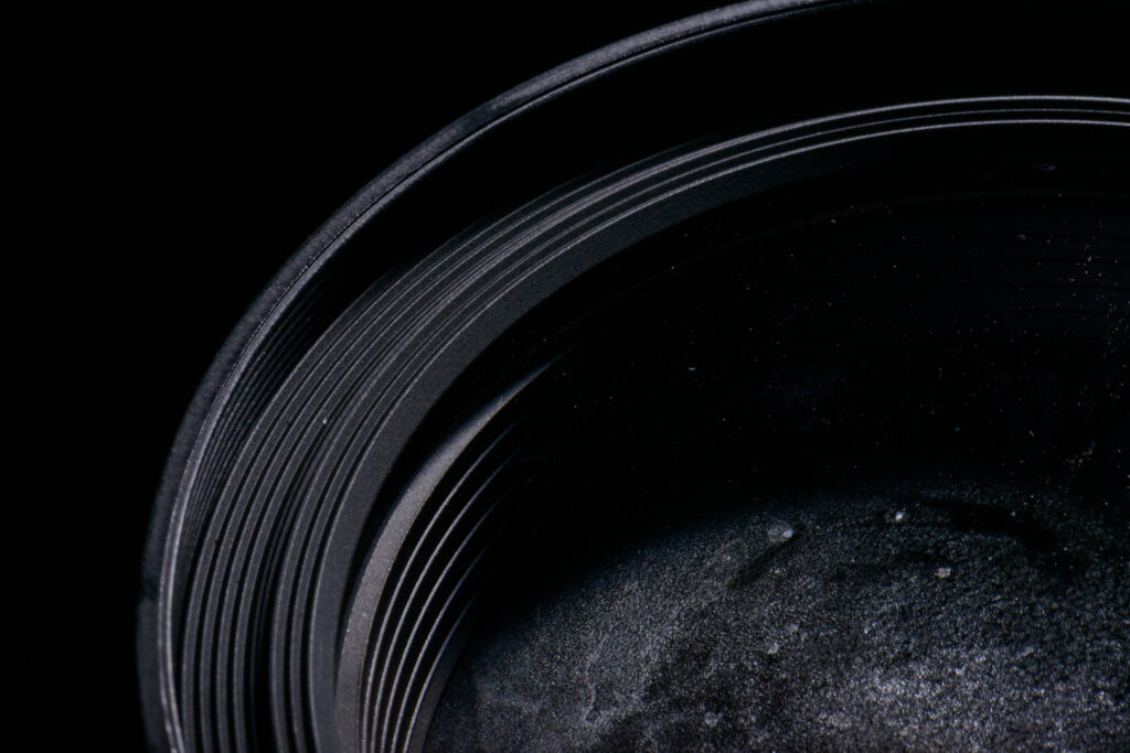 Macro Metallic Texture Wallpaper: Dark Grooved Surface Details