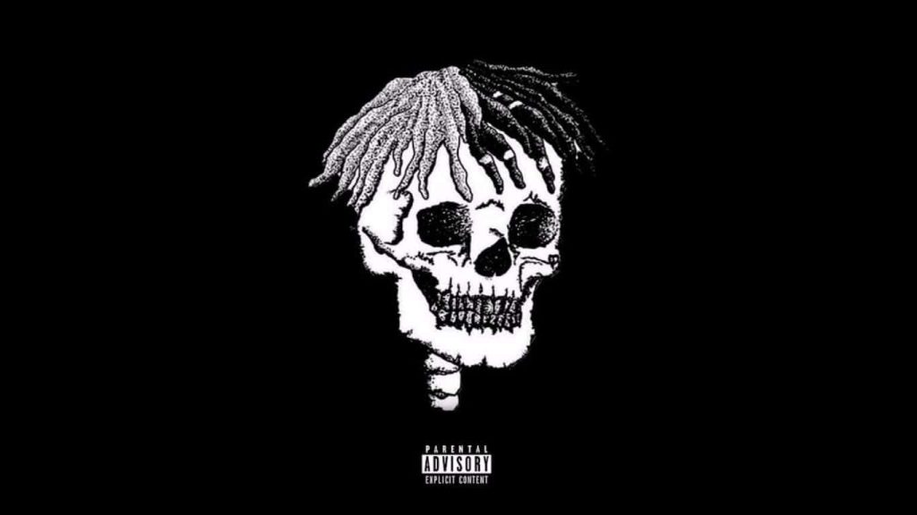 Dark minimalist wallpaper with stylized skull and XXXTentacion split-color dreadlocks background