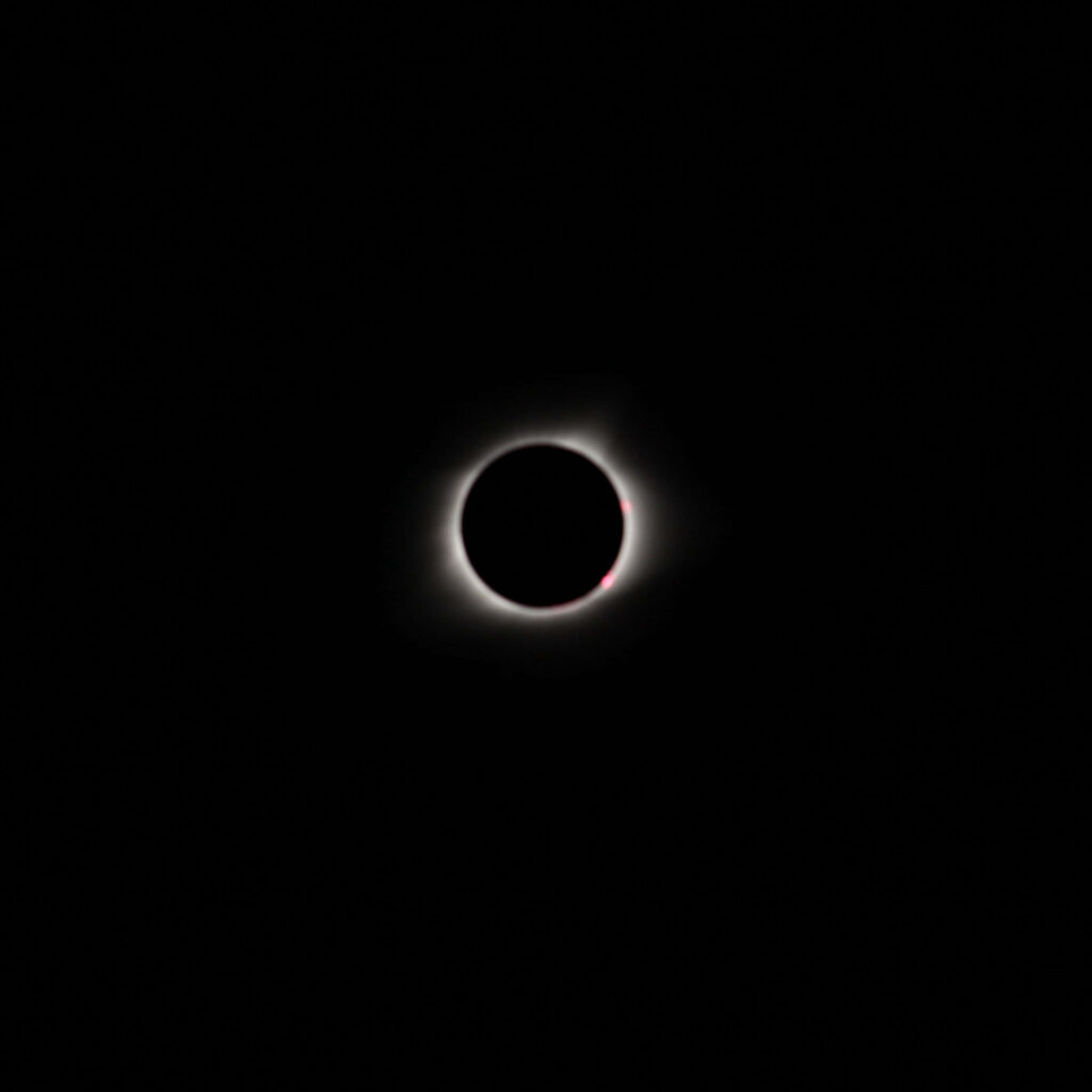 Stunning Solar Eclipse iPad Wallpaper: Dark, Minimalist Design