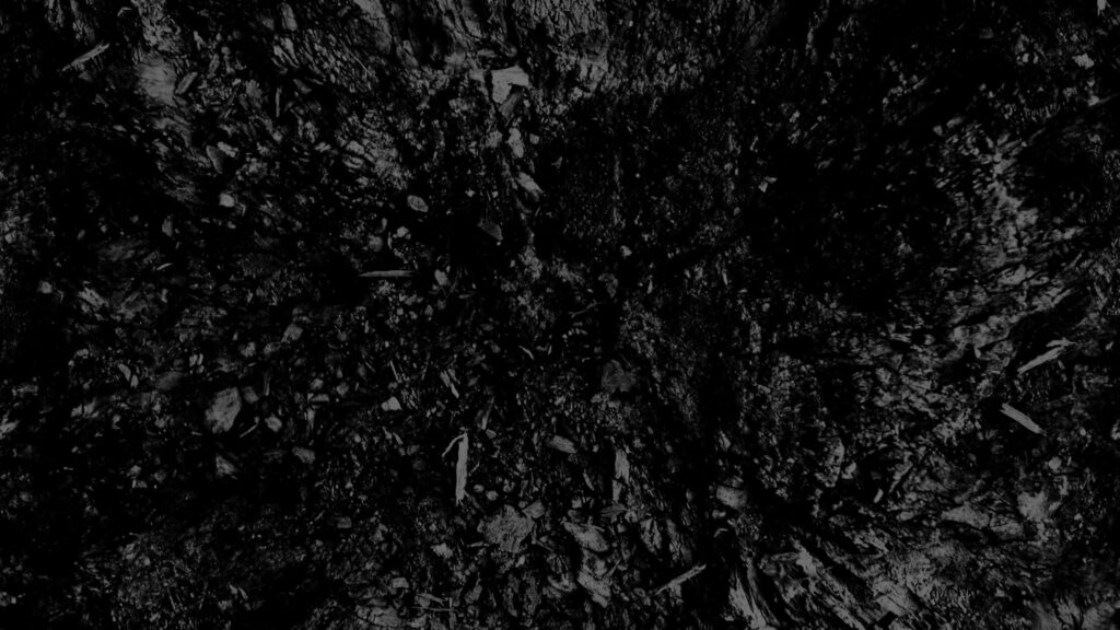 Textured Dark Monochrome Wallpaper: Rugged Geological Pattern Background