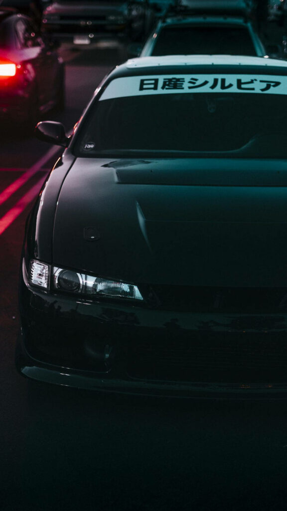 Dark Nissan Silvia JDM car under evening lights showing mysterious street racing vibe wallpaper