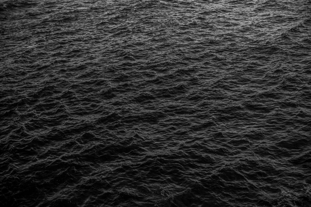 High-Res Sea Texture Wallpaper: Dark Waves & Dramatic Water Surface