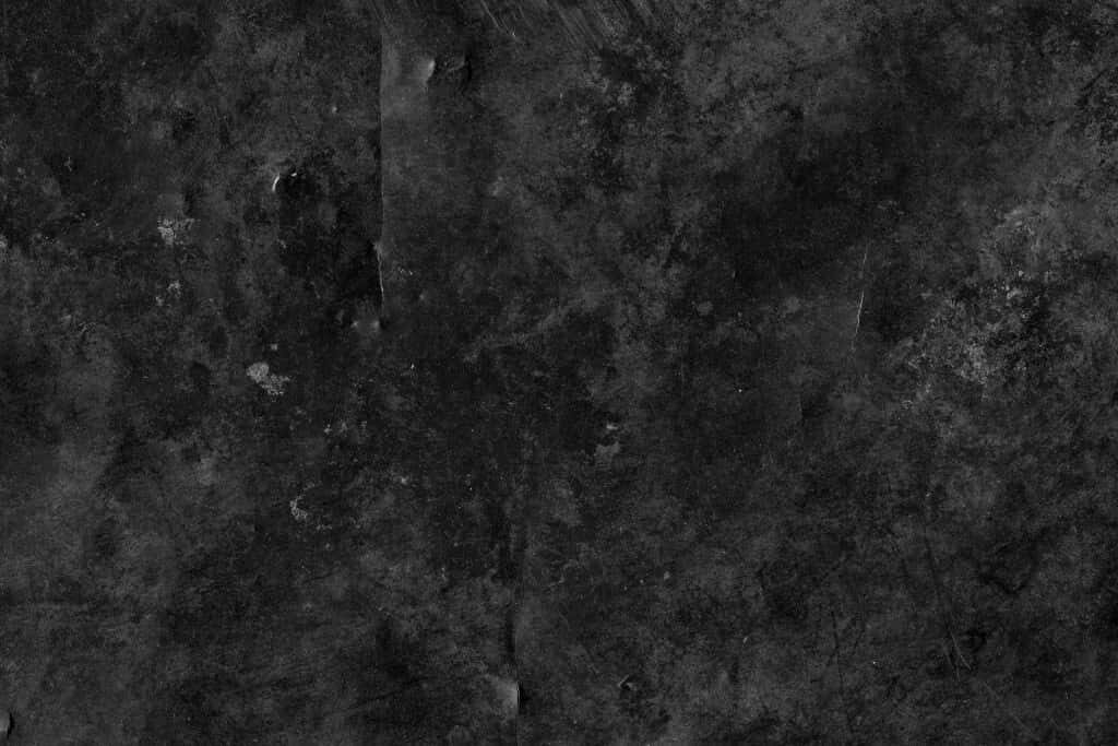 Edgy Black Grunge Wallpaper: Rugged, Textured, and Moody Background