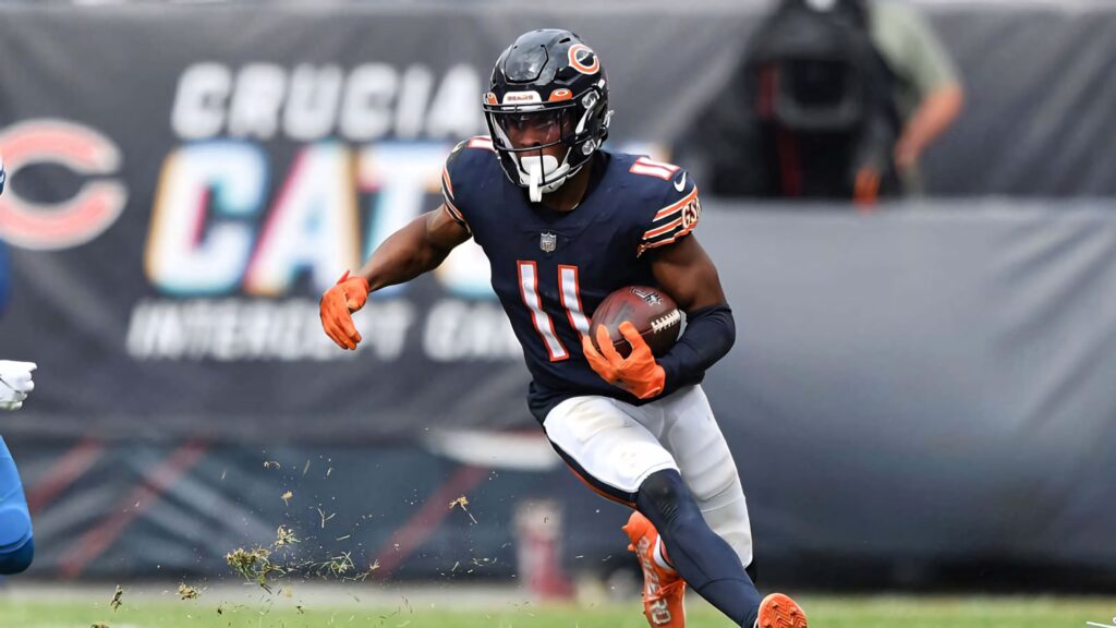 Darnell Mooney sprinting in Chicago Bears uniform showcasing intense football action and energy Wallpaper