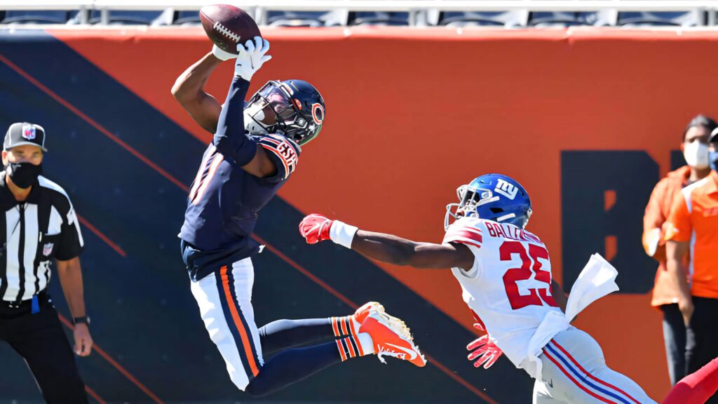 Darnell Mooney leaps for a spectacular catch in Chicago Bears uniform against Giants defender Wallpaper
