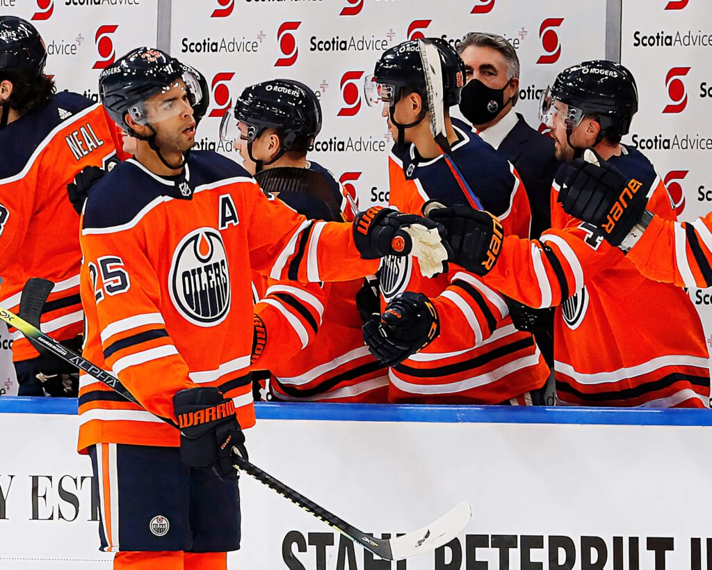 Darnell Nurse Edmonton Oilers 2018 game action celebrating with teammates in orange uniforms Wallpaper